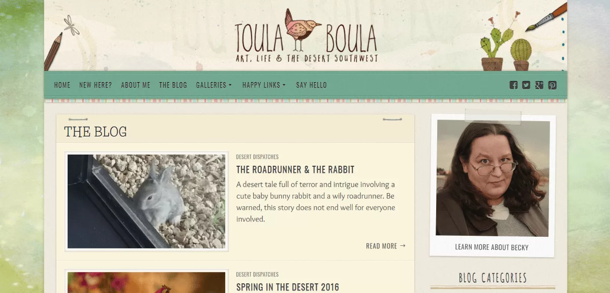 Toula Boula website layout features posts in a single column with images on one side and text on the other, resembling paper stapled or taped to a watercolor background. The harmonious color scheme perfectly blends with the artistic background.